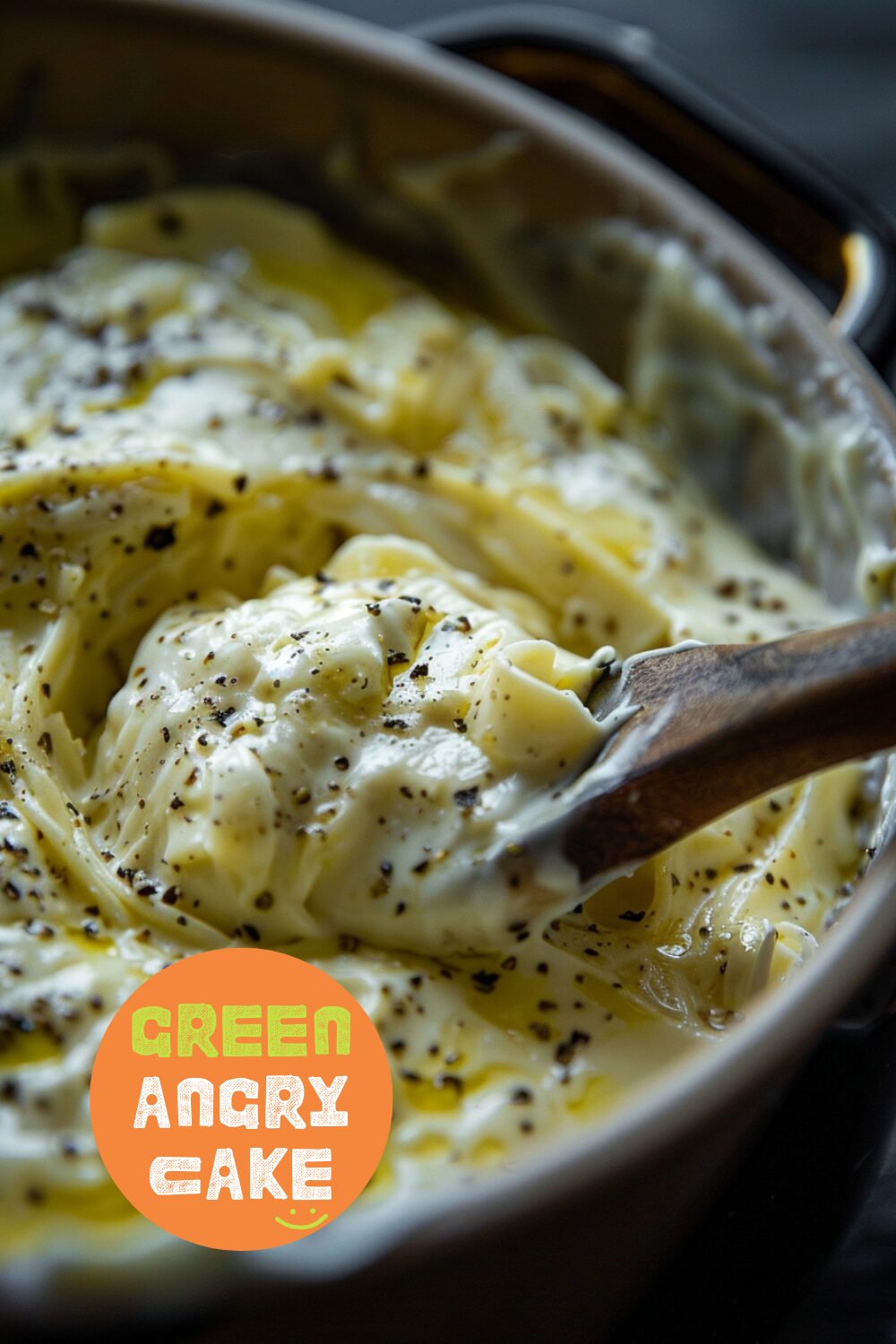 Close-up of stirring the creamy Alfredo sauce in the Instant Pot, with a focus on the creamy texture. Background is a dark, black wooden texture surface.