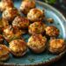 Top-down view of Umami Bomb Stuffed Mushrooms on a blue plate, showcasing their golden tops and finely chopped parsley garnish.