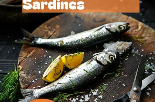 A vibrant photo showing a sardine being cleaned and filleted on a chopping board, with a sharp knife and scissors nearby. The background is a dark, black wooden texture surface. This image demonstrates sardine cleaning techniques.